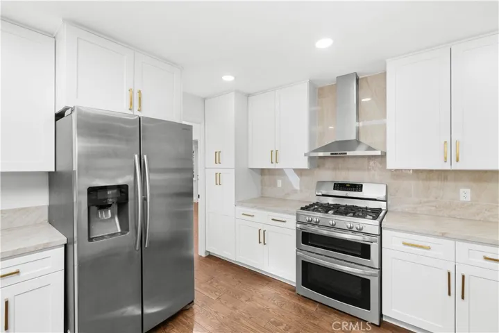 Kitchen has full-height cabinets and pantries on both sides of the stove!