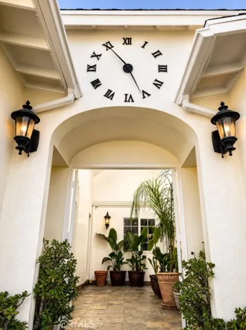 Double door entry under clock tower.