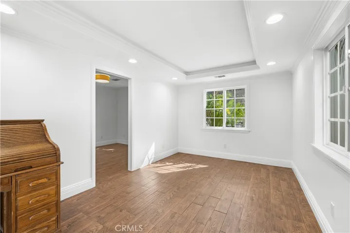 View from foyer into office.  Tray ceiling, hidden LED accent rope lighting, and recessed LED lighting.