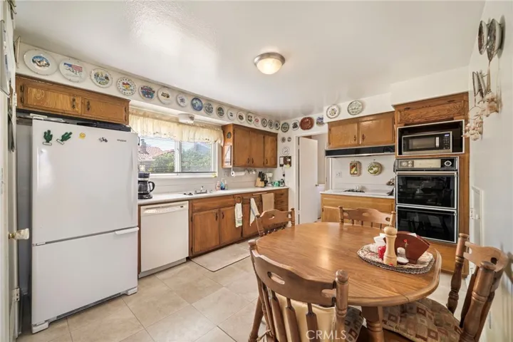 Gas cooktop, gas oven, dishwasher, and microwave niche