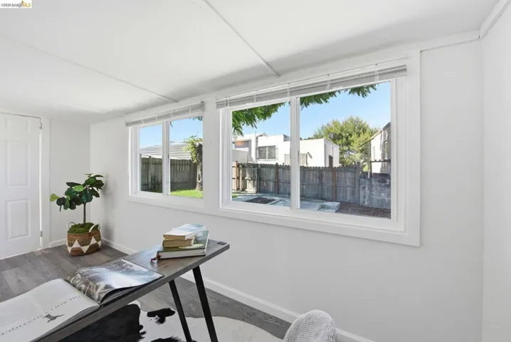 Dual windows featuring white blinds, offering abundant natural light