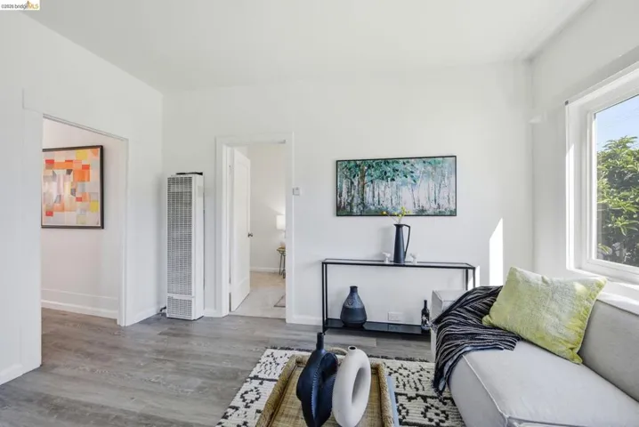 Bright interior space featuring white walls and light wood-finish flooring
