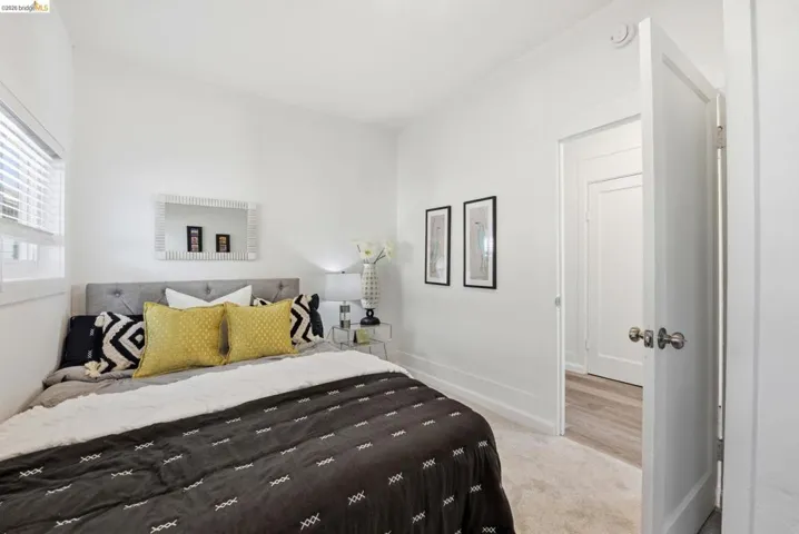 Bedroom with light-toned carpet flooring and a neutral color palette