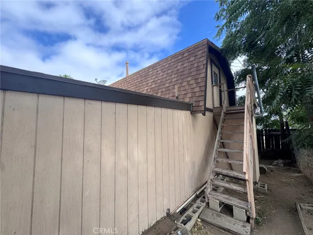 stairs go towards a second floor storage area