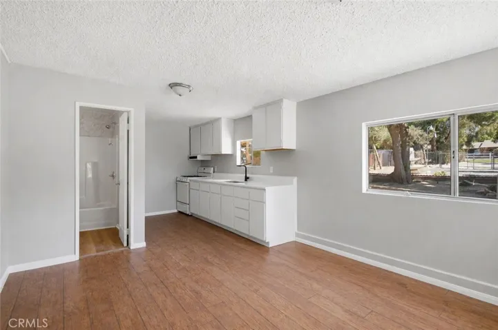 Cottage entry, kitchen, full bathroom and living space