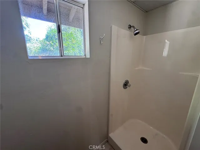 toilet and shower inside the 2 car garage