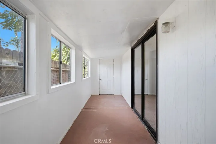Cottage covered and enclosed patio attached to the bedroom