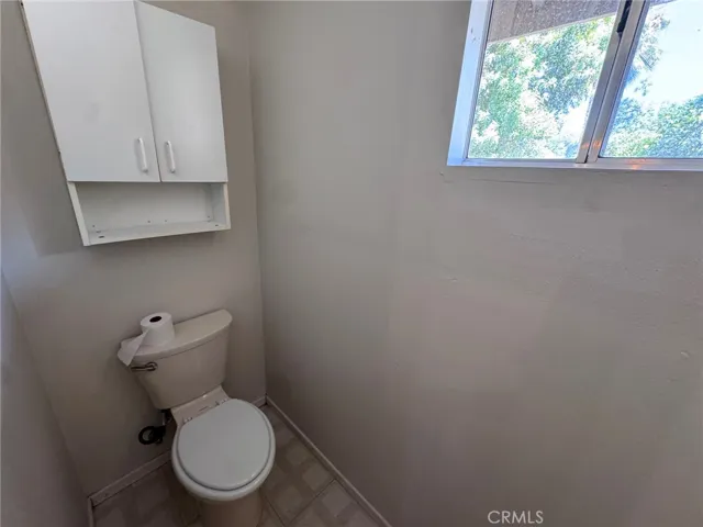 toilet and shower inside the 2 car garage