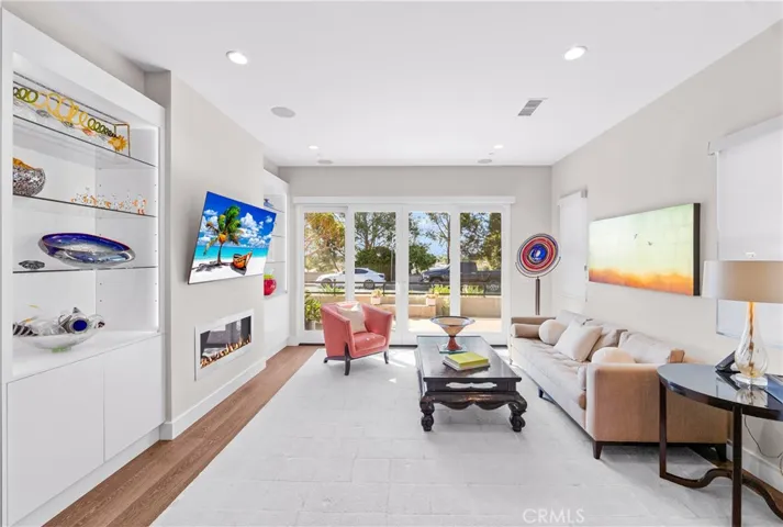 Custom built-ins & a sleek fireplace add style, function & architectural interest.