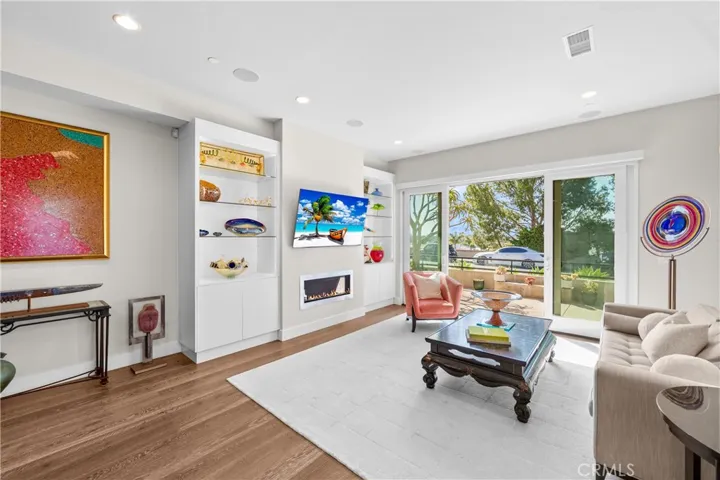 Custom built-ins & a sleek fireplace add style, function & architectural interest.