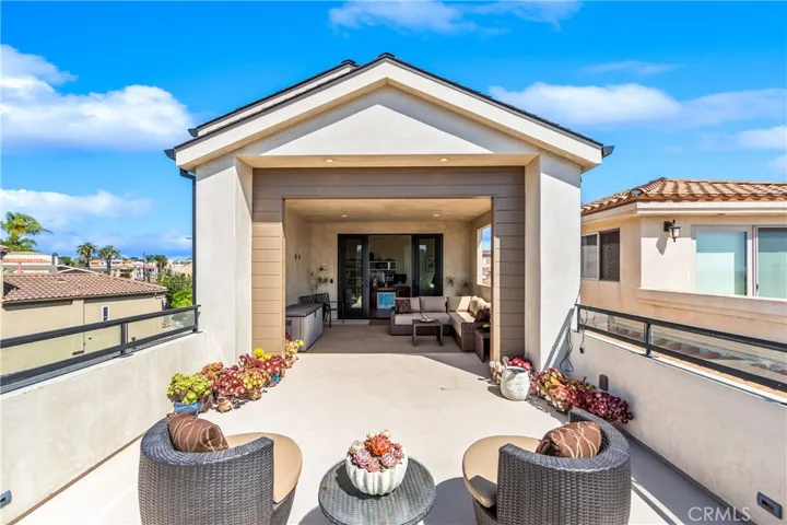 Designed for year-round enjoyment, this versatile terrace includes a covered lounge area with TV wiring, recessed lighting and an open-air sun deck