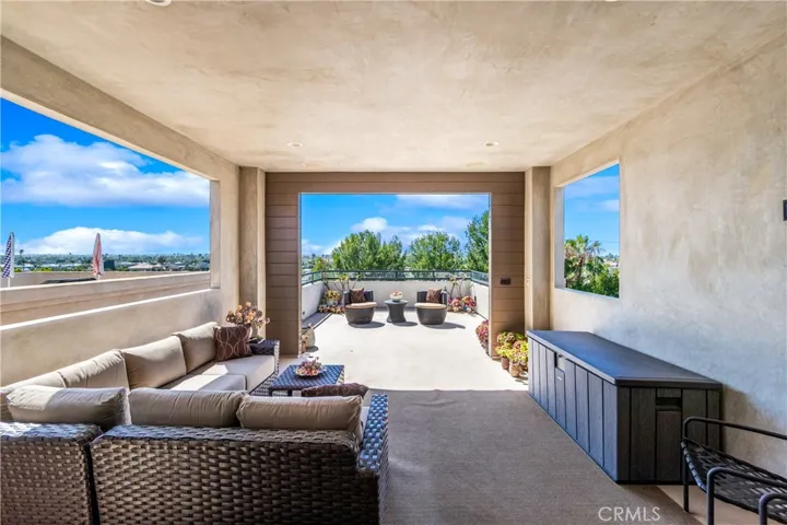Designed for year-round enjoyment, this versatile terrace includes a covered lounge area with TV wiring, recessed lighting and an open-air sun deck with a 180-degree panoramic view.
