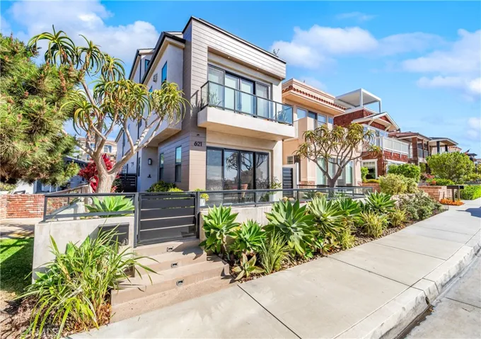 Custom coastal contemporary architecture by Goodman Development, ideally positioned on an elevated Downtown Huntington Beach lot.