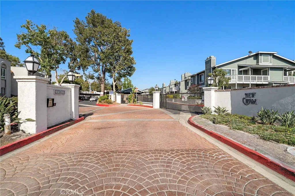 Community Entrance: Welcoming entrance to the highly desirable New Chase community with beautifully maintained grounds and mature landscaping.