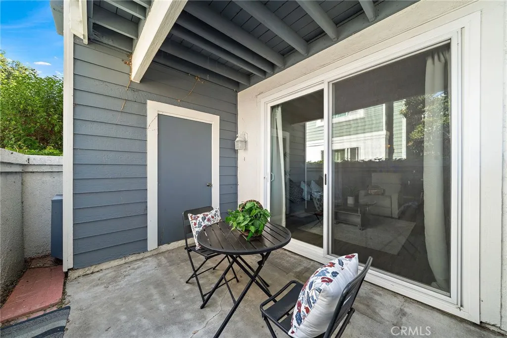 Private Patio: Private covered patio with sliding glass door access. Storage room and A/C unit.