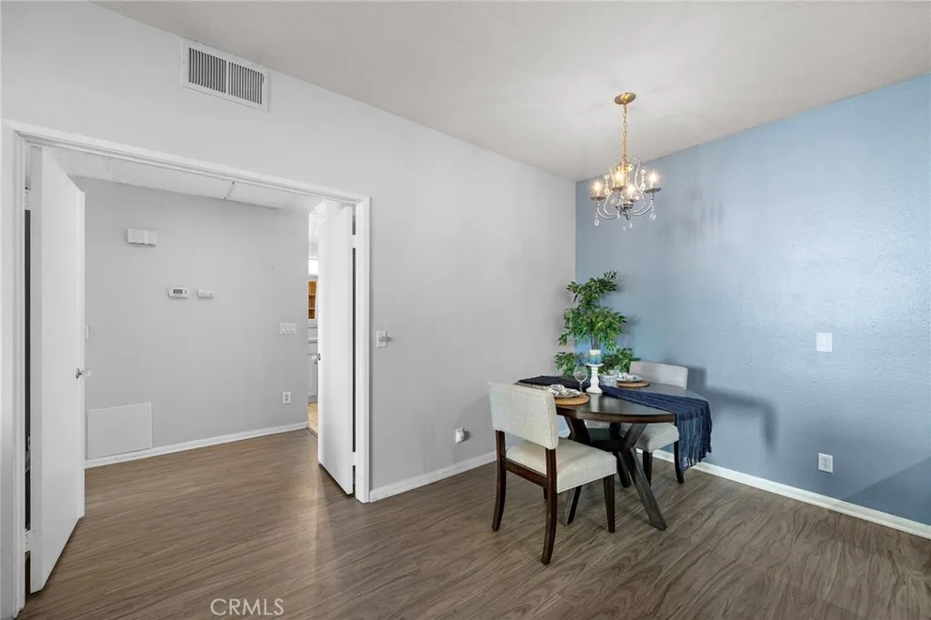 Dining Area: Inviting dining area with chandelier.