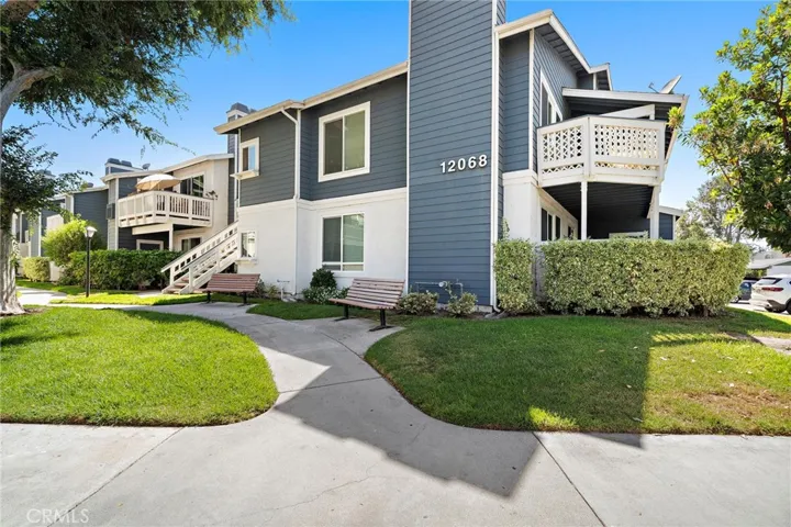 Beautifully maintained Cape Cod-style exterior with lush landscaping, manicured greenbelts, and inviting walkways.