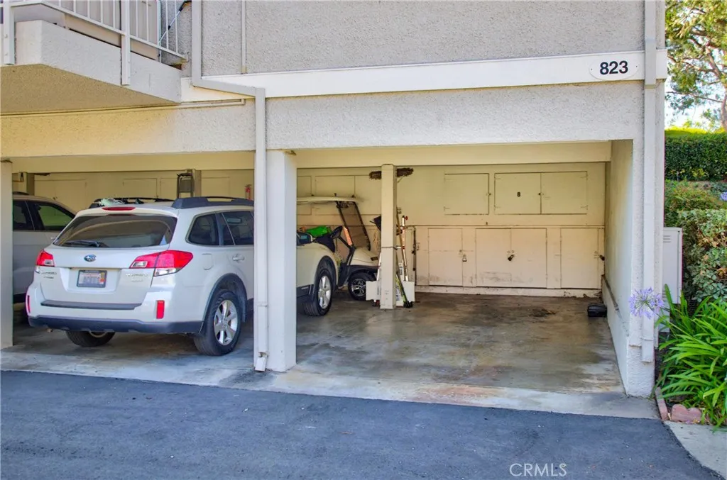 end-unit carport parking. upper and lower cabinets too.