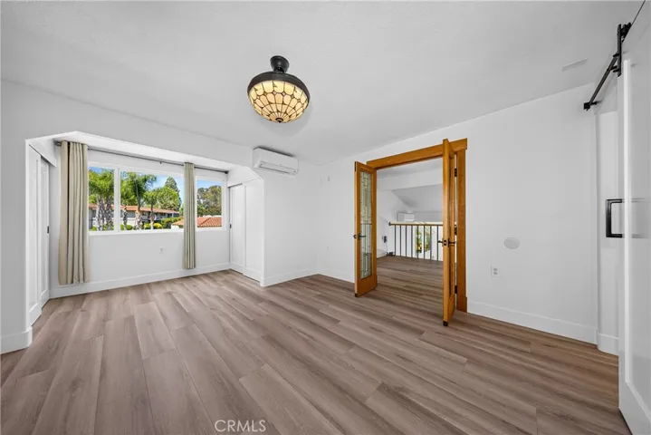 guest suite upstairs with enclosed balcony now living space