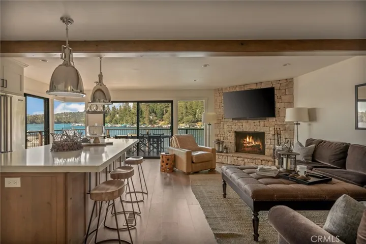 OPEN LIVING ROOM TO KITCHEN AND OUTDOOR DECK FOR ENTERTAINING