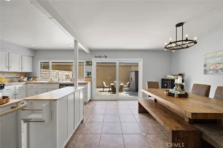 Dining room seamlessly flows into kitchen and private patio