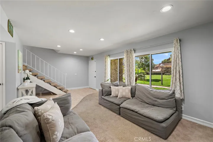 Large, cozy living room with recessed lighting