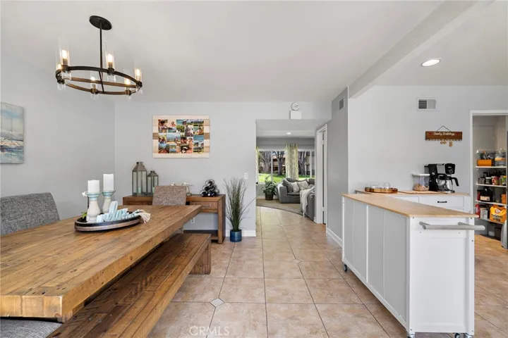 Kitchen seamlessly flows into a warm and inviting oversized dining area
