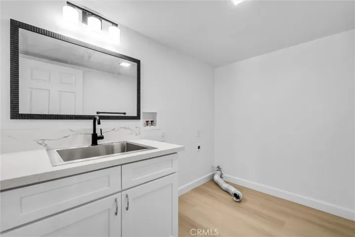 Laundry room with a large utility sink