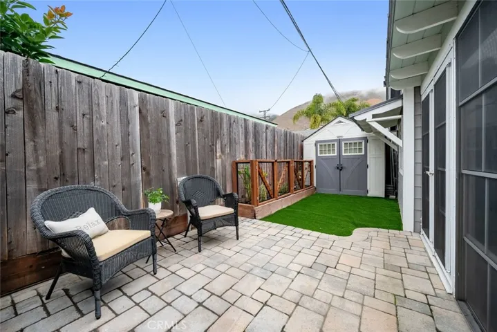 Private backyard with extra storage in shed