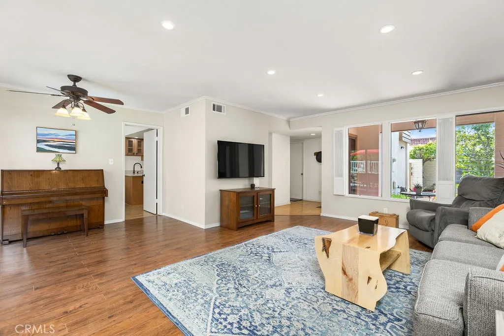 Large windows bring the outside - in... Living room overlooks private front porch/courtyard and backyard.
