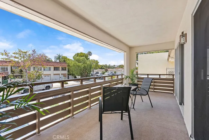 Spacious front deck share by two upper guest rooms.  New outdoor carpet installed in 2026. *This area has been enclosed by other owners to add additional square footage.