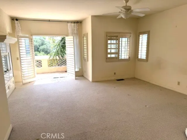 Main bedroom with balcony overlooking the  golf course
