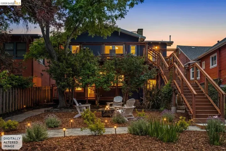 Multi-level exterior featuring multiple wood staircases and railings, a landscaped yard with established plantings, and perimeter fencing