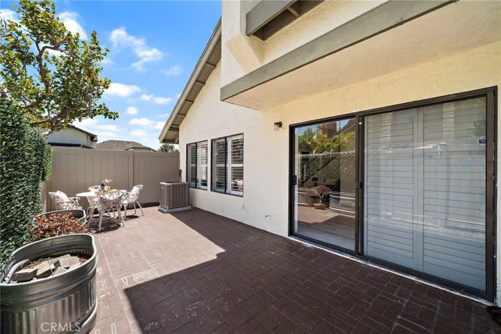 Nice patio with pavers and PVC fencing
