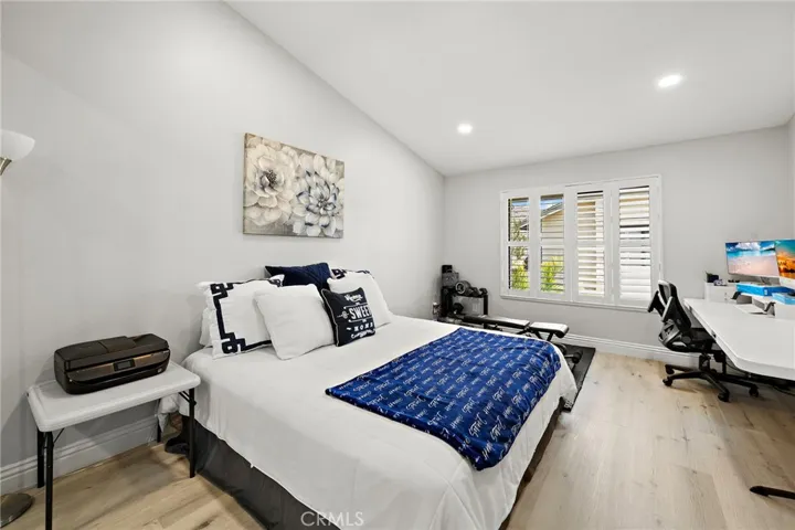 Primary suite with high ceilings and recessed lighting