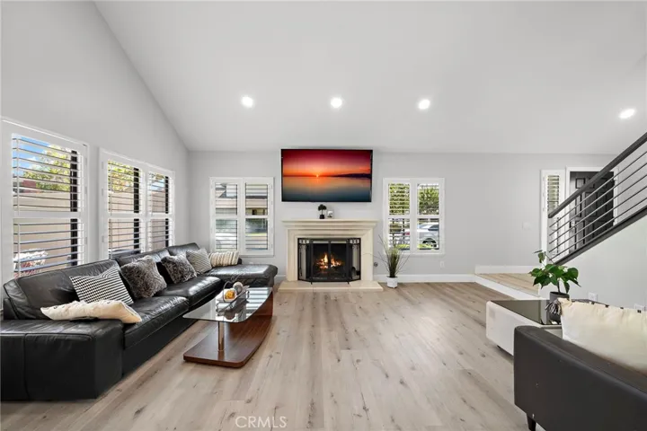 Living room w/ high ceilings, custom fireplace