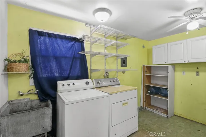 Laudry Room with utility sink and storage room