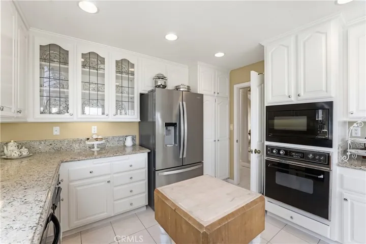 Remodeled kitchen with granite countertops. Refrigerator is included.