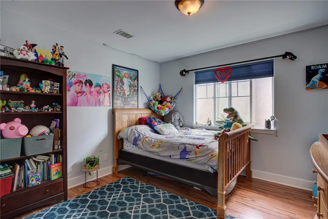 Bedroom 1 with large window and wood flooring (Upstairs) Bedroom 1 with large window and wood flooring (Upstairs)
