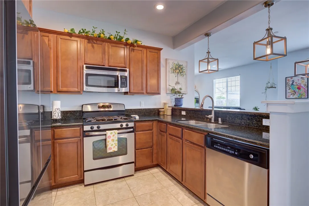Wood cabinetry and stainless appliances Wood cabinetry and stainless appliances