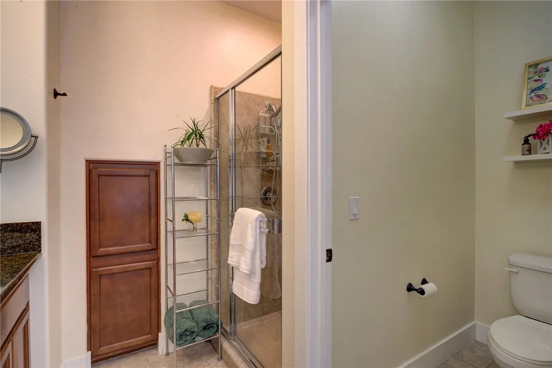 Primary Bathroom with glass-enclosed shower (Downstairs) Primary Bathroom with glass-enclosed shower (Downstairs)