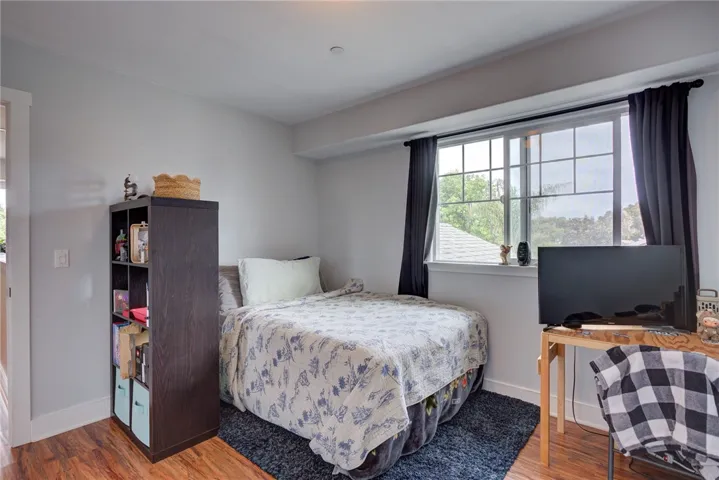 Bedroom 2 featuring a bright space with large window (Upstairs)