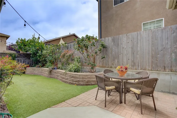 Private backyard patio with paved seating area