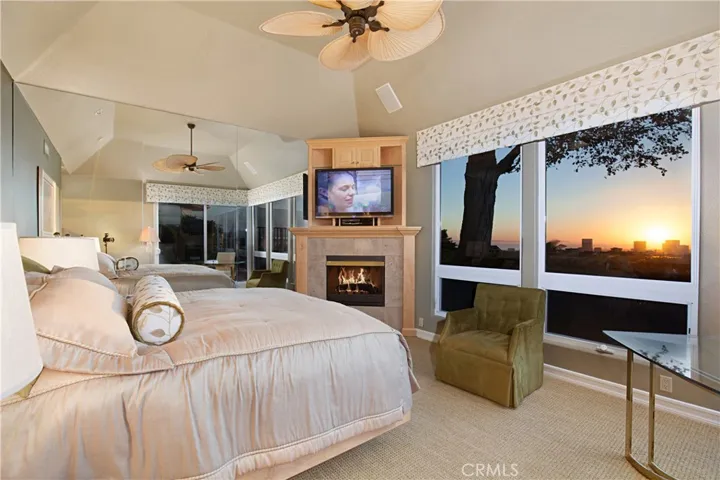 Primary Bedroom with a Fireplace and Breathtaking View.