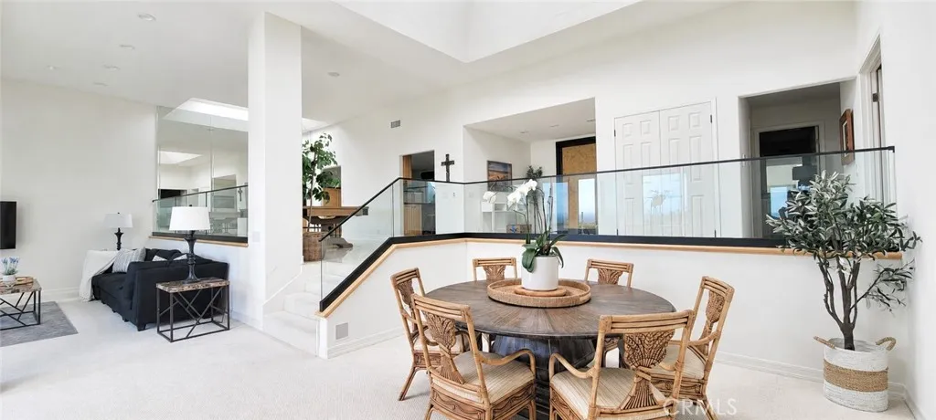 Desirable Open Floor Plan With Volume Ceiling and Newly remodeled glass railing.