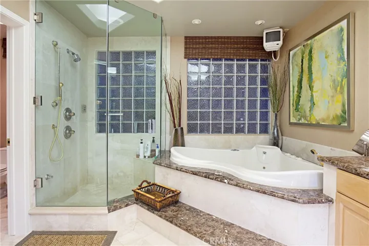 Upgraded Primary Bathroom With a Walk-In Closet.