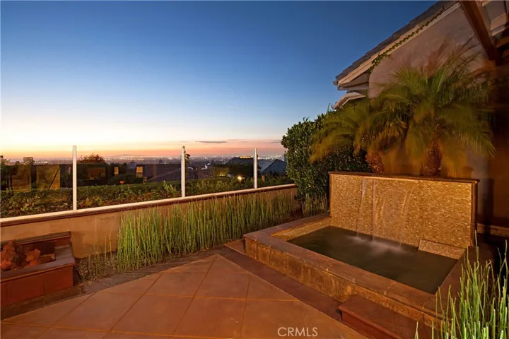 Entertaining Backyard Featuring a Jacuzzi with Waterfall, Fire-Pit, Built-In BBQ and panoramic view.