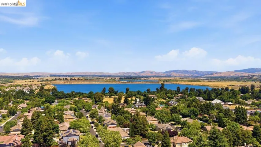 Aerial perspective highlighting a residential community with mature trees