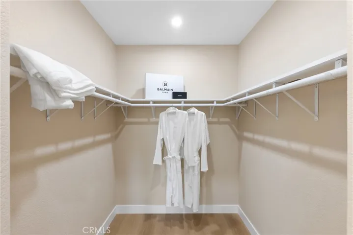 Walk in closet in upstairs primary bedroom