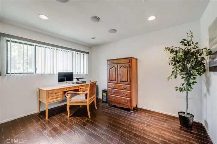 Bedroom #3 (Currently being used as an Office) boasts Hardwood Flooring, Recessed Lighting, and Storage